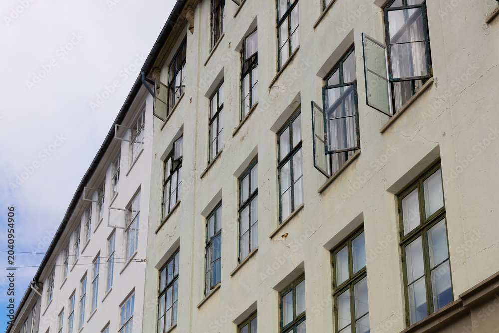 Obraz premium Historic Apartment Building With Open Windows