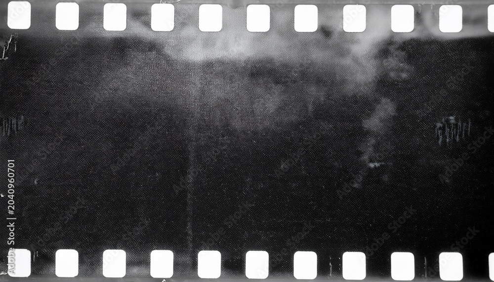 Fototapeta premium film noise texture and background old film frame from analog retro film roll photo texture with grain and scratches for vintage effect with damaged film burn look