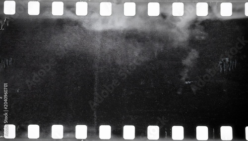 film noise texture and background old film frame from analog retro film roll photo texture with grain and scratches for vintage effect with damaged film burn look