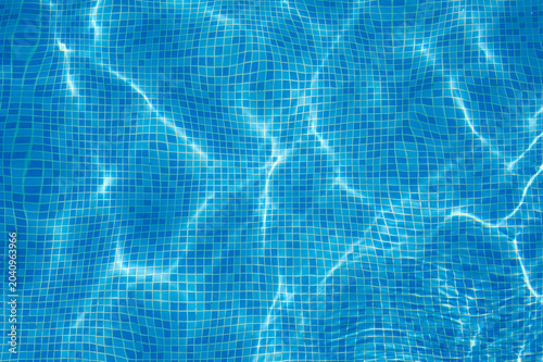 Blue water background. Water in the pool. Top view.