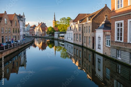 Afternoon view of canals and historic houses in Bruges