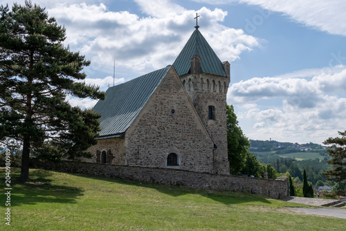 Historic Stone Church of St. Michael the Archangel Overlooking Rural Landscape