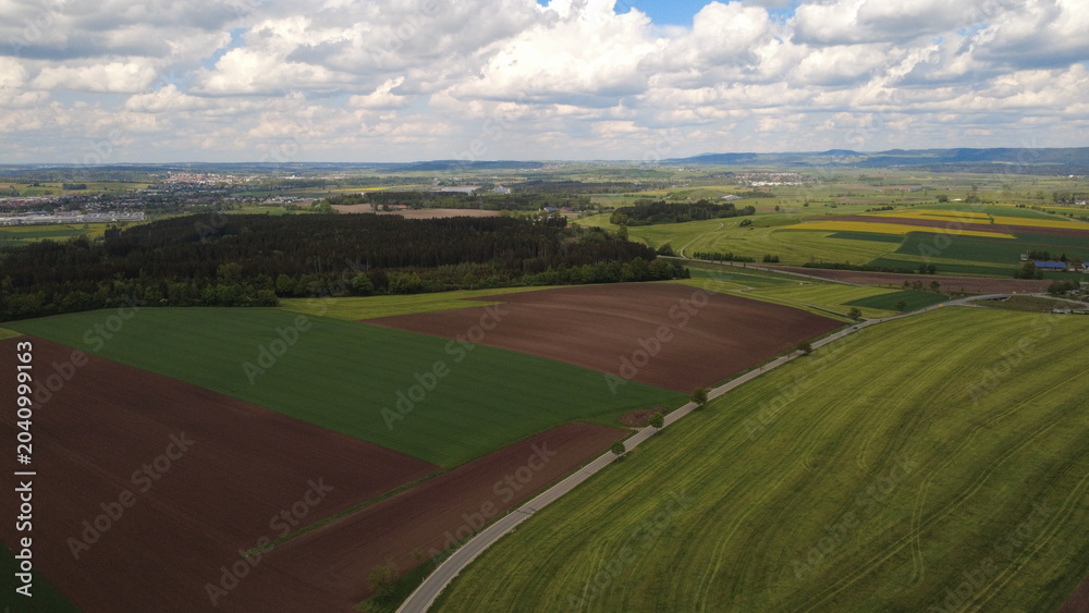 Naklejka premium Aerial drone view of colorful farmland fields and rural countryside