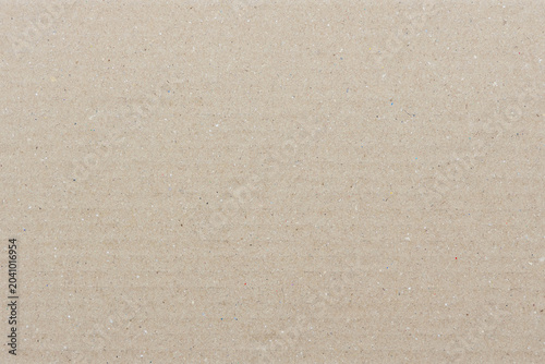 Beige recycled cardboard texture background for eco design. Natural cardboard paper backdrop with minimal texture