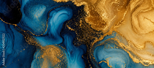 Flowing blue ink with gold metallic swirls in abstract fluid motion