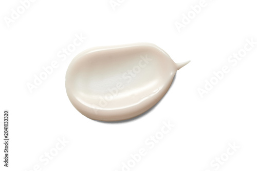 Cream smudge creating a cosmetic swatch, showing texture on a white background, ideal for beauty and skincare concepts