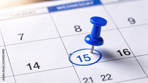 Blue Pushpin on Fifteenth Day of Calendar Grid Close Up View