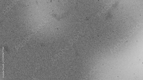 Monochrome grain noise overlay background with dirt grunge seamless loop