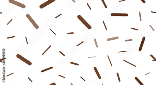 Seamless pattern featuring various shades of brown sprinkle-like shapes scattered randomly on a white background creating a sweet texture.