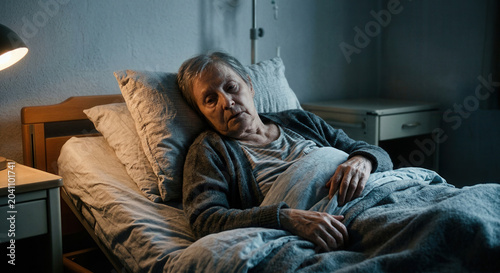 Elderly Patient in Hospital Bed, Illness, Healthcare, and Medical Condition Concept