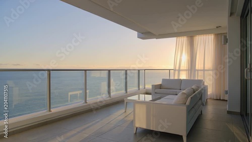 Modern Luxury Balcony Overlooking Ocean at Sunrise, Illustrating Serene Upscale Lifestyle