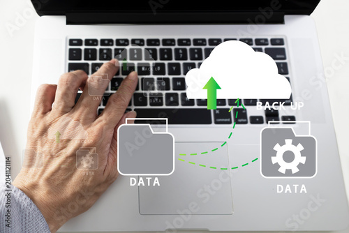 Bild auf Leinwand The concept of using the cloud to support data and prevent data loss, retrieving