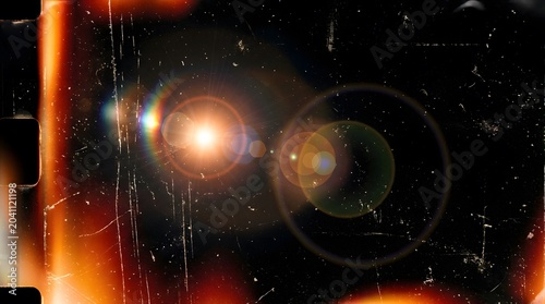 Retro film overlay background featuring scratches dust light leaks lens flare on black backdrop texture