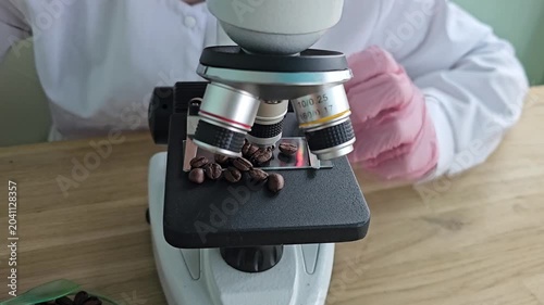Examining coffee beans under a microscope in a research lab for quality assessment