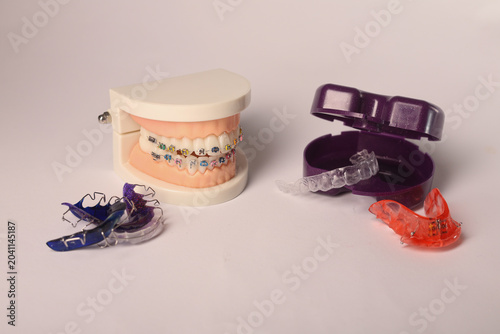 Foto Dental braces model with orthodontic appliances isolated on white background