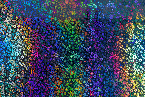 Multicolored holographic star pattern with iridescent reflective gradient texture