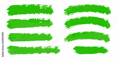 set of ten vibrant green brush strokes on white background paint marks