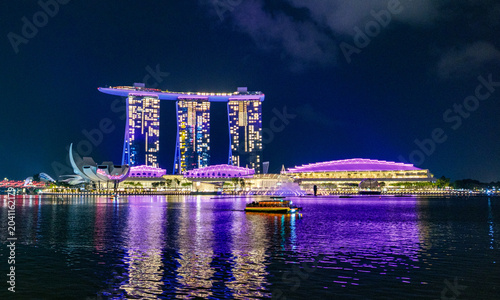 Canvas Print Illuminated Singapore CBD skyscrapers reflecting on calm Marina Bay waterfront d