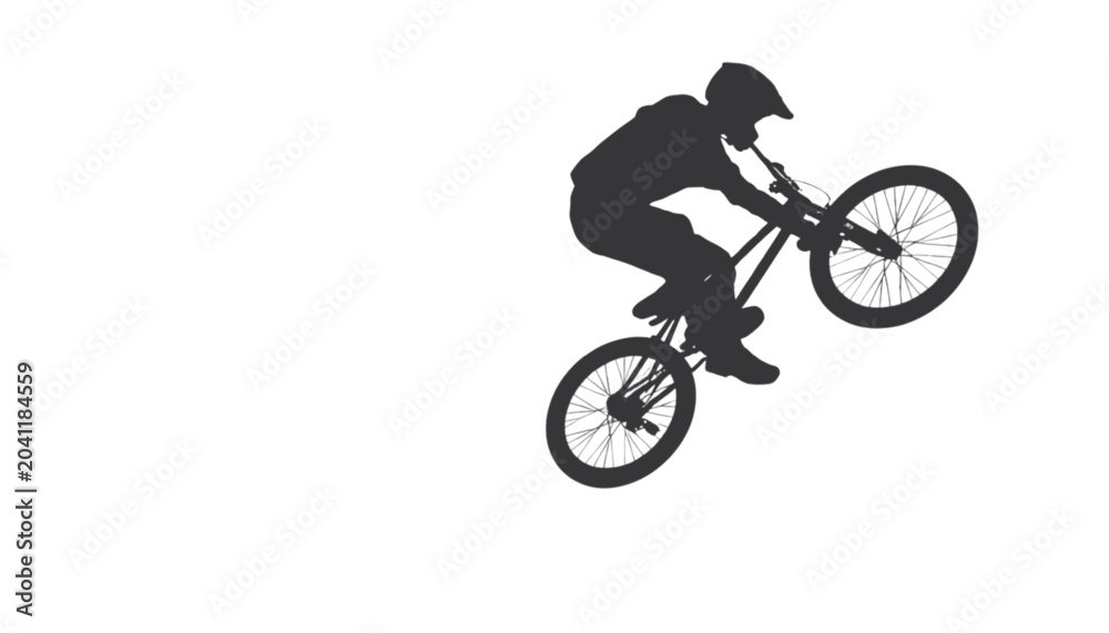 Obraz premium Biker silhouette executes a technical wheelie maneuver on a bicycle during a high energy performance.