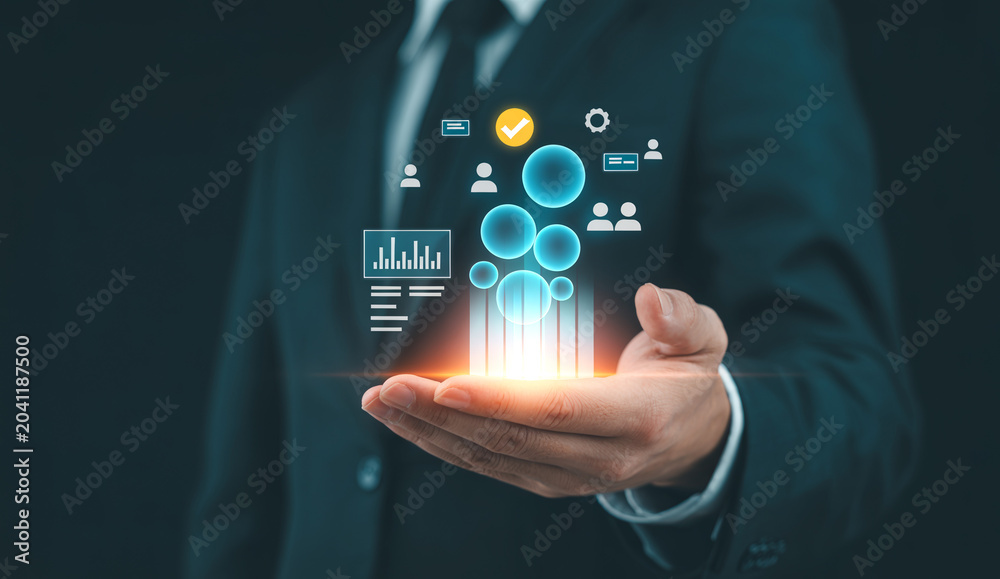 Fototapeta premium Businessman holding data analytics hologram, business intelligence, market research, financial reports, digital marketing, corporate management, customer relationship management