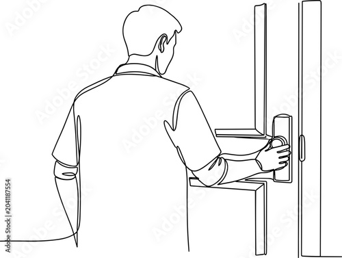 Man opening a door, hand on the handle, entering or leaving a room