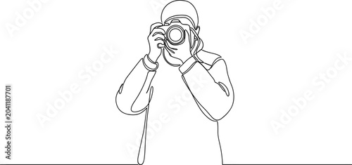 Continuous line drawing of a person taking a photo with a camera.