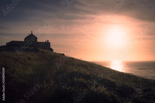 Sunset on the Cornish coat at the Chapel of St Nicholas, St Ives.