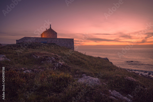 Sunset on the Cornish coat at the Chapel of St Nicholas, St Ives.