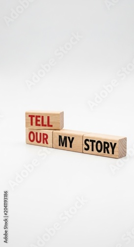 Wooden Blocks Spelling Out Tell Our My Story on White Background.