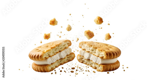 A broken ice cream sandwich with crumbs flying on transparent background