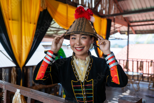 Portrait of Kadazan Dusun girl in Papar traditional attire during Kaamatan Festival in Kota Kinabalu Sabah Malaysia