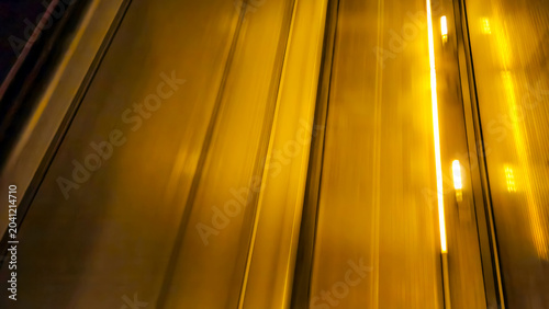 Bild auf Leinwand abstract golden motion blur at night representing high-speed public transit and