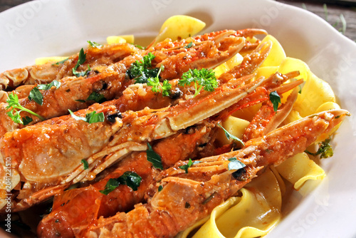 фотографія Skampi na buzaru - a traditional Croatian shrimp dish