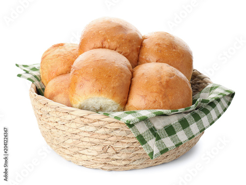 Bild auf Leinwand Freshly baked buns in wicker basket isolated on white