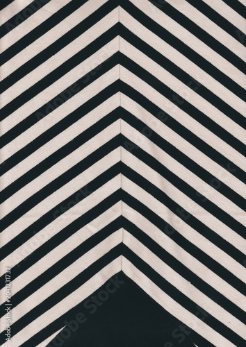 Black and white chevron pattern on fabric with soft focus