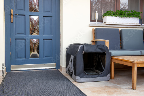 black empty soft pet crate on terrace