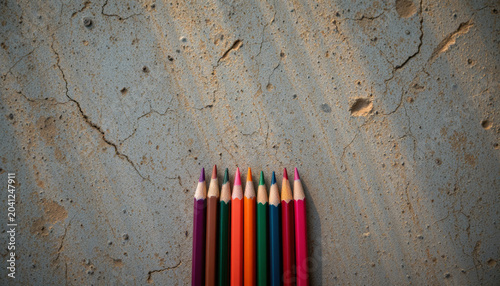 Colored pencil Cracked surface Gray background Shadow Art supplies Creativity Drawing tools Colorful Wooden pencil Texture Close up Stationery
