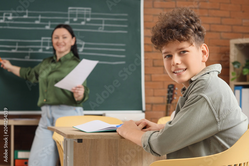 Teenage boy learning music ...