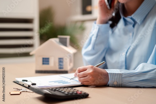 Photography Real estate agent calling client for property contract and mortgage