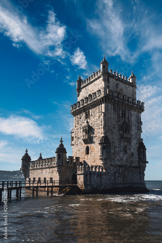 Belém Tower by the Tagus River: A Historic Landmark Under a Blue Sky