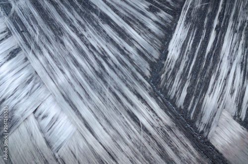Close up of gray carbon fiber weave pattern for high tech manufacturing