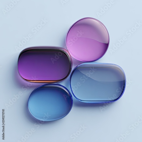 Four Translucent Gemstones Arranged Artfully on a Light Blue Background.