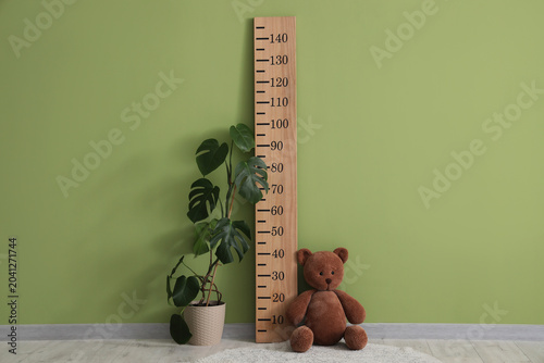 Stadiometer with toy bear a...