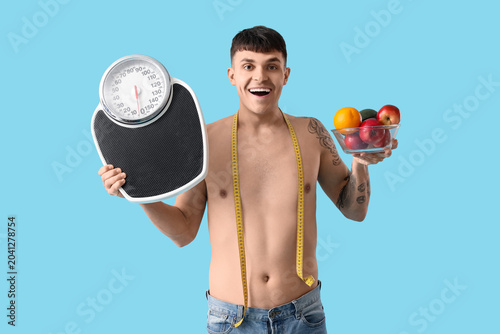 Young man with measuring ta...