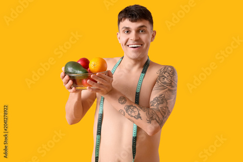 Young man with measuring ta...