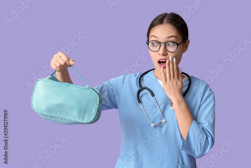 Shocked Asian female doctor...