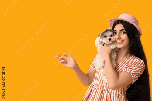 Young happy woman in hat ho...