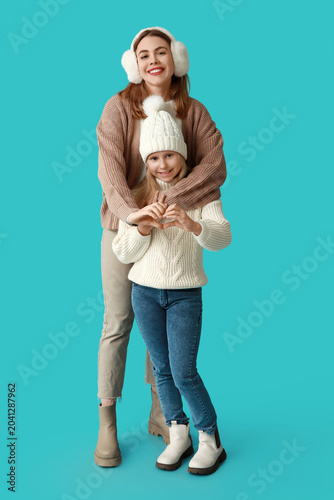 Smiling mother and daughter...