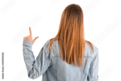 Foto Young woman showing loser gesture on white background, back view