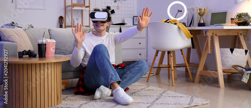 Male student using VR glass...